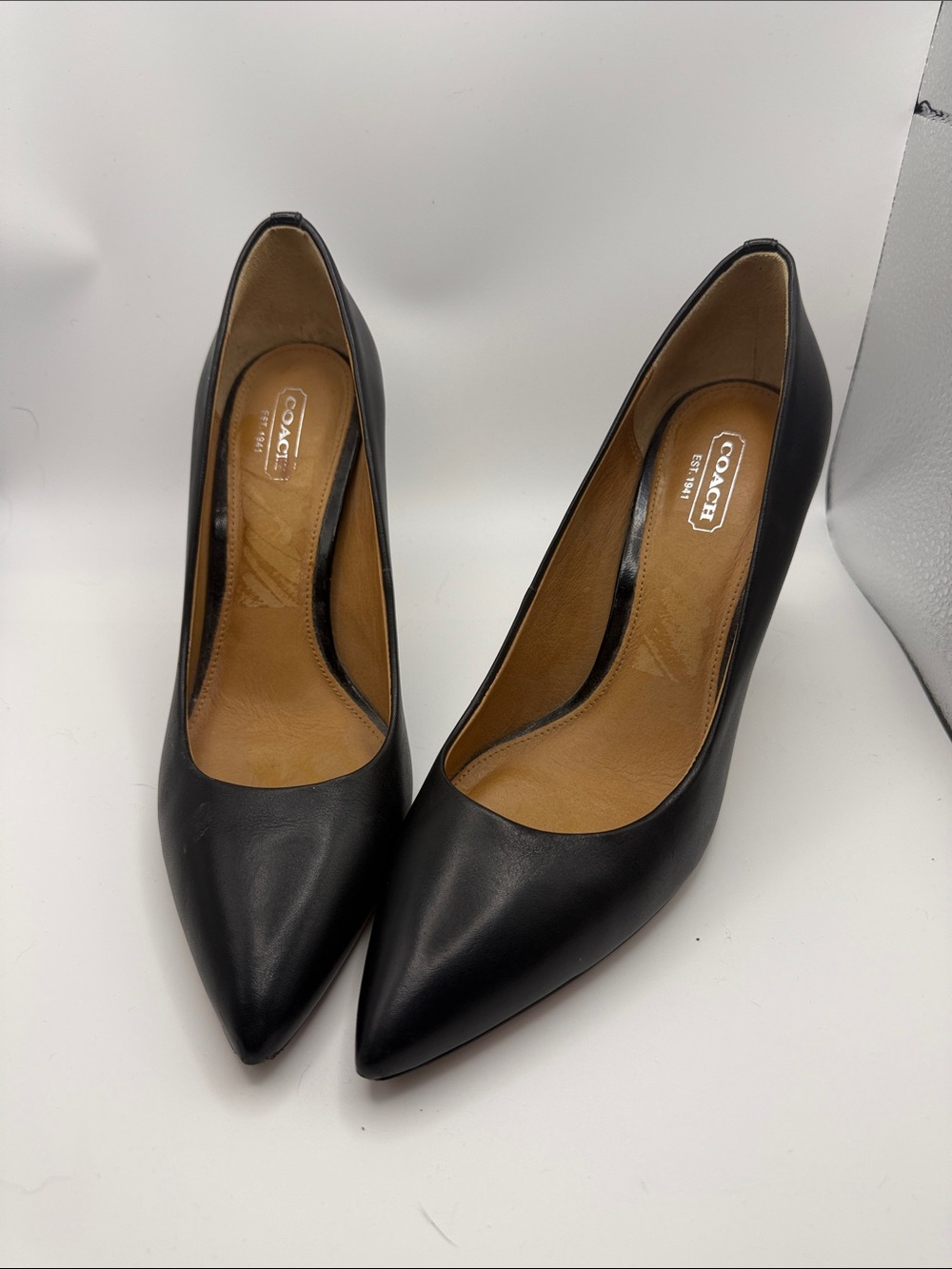 Coach Black Leather Pointed-Toe Pumps with Tan Insole